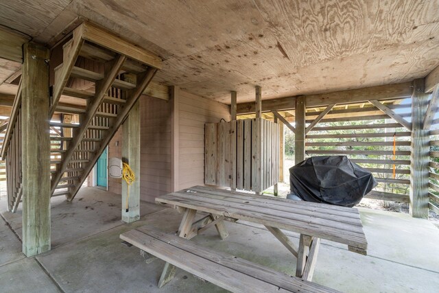 view of patio / terrace featuring a grill and stairway