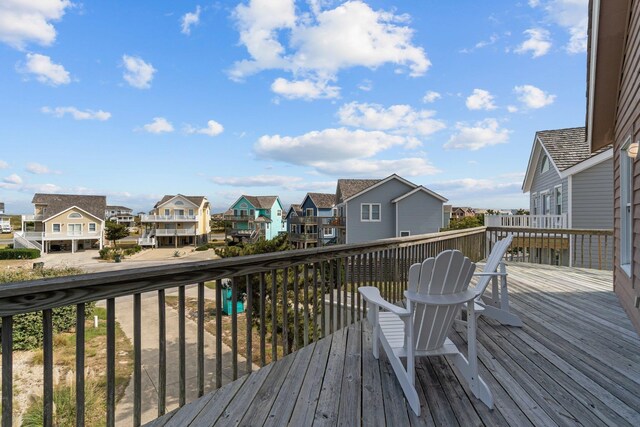 wooden deck featuring a residential view