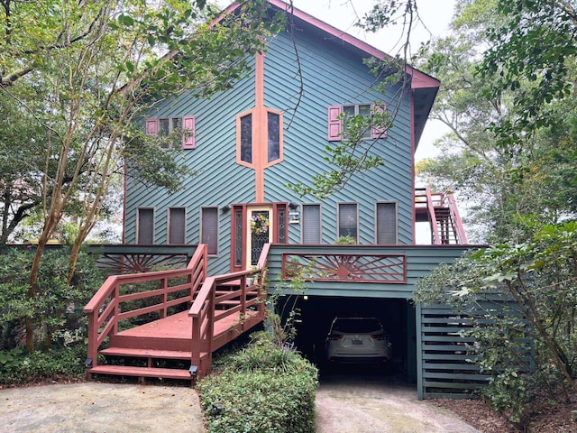 view of front of home with stairs and a wooden deck