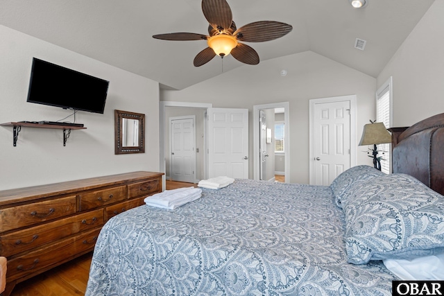 851 Corolla Dr Lot 59, Corolla, NC 27927 - bedroom with multiple windows, vaulted ceiling, wood finished floors, and visible vents