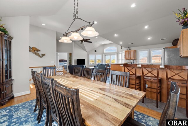 dining area with a ceiling fan, vaulted ceiling, recessed lighting, and visible vents