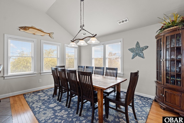 851 Corolla Dr Lot 59, Corolla, NC 27927 - dining area featuring light wood finished floors, visible vents, baseboards, and vaulted ceiling