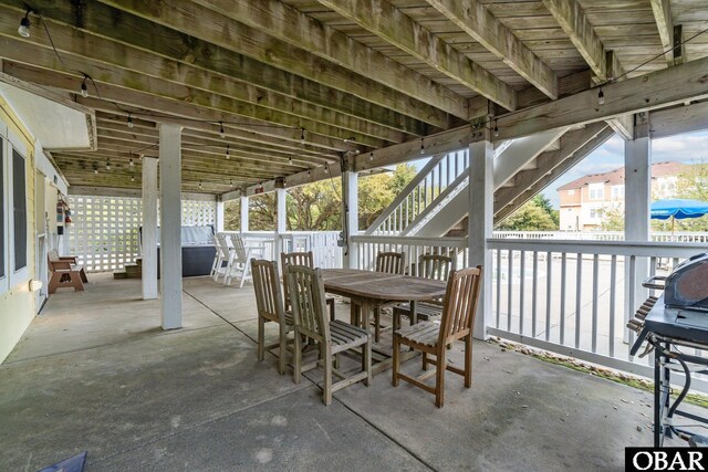 view of patio / terrace featuring stairway and outdoor dining space