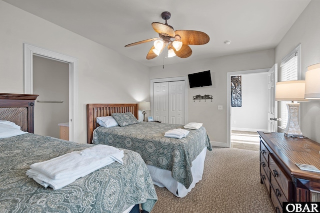 851 Corolla Dr Lot 59, Corolla, NC 27927 - carpeted bedroom featuring a closet, baseboards, and ceiling fan