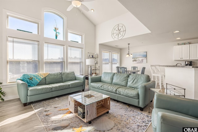 1700 Paget Rd Unit B3, Kill Devil Hills, NC 27948 - living room with a ceiling fan, high vaulted ceiling, light wood-style floors, recessed lighting, and baseboards