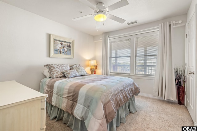 1700 Paget Rd Unit B3, Kill Devil Hills, NC 27948 - bedroom featuring light colored carpet, baseboards, and a ceiling fan