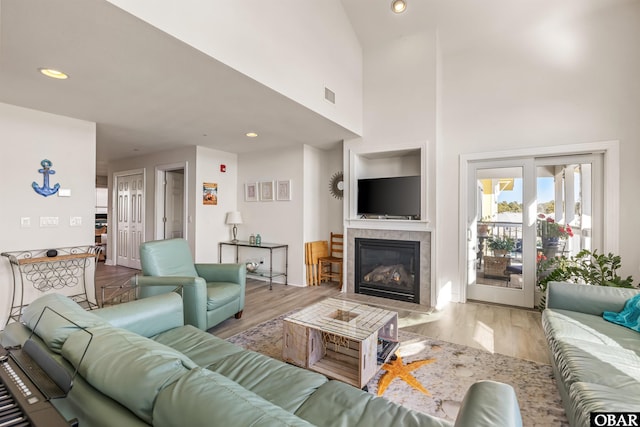 1700 Paget Rd Unit B3, Kill Devil Hills, NC 27948 - living area featuring wood finished floors, a fireplace, recessed lighting, and a high ceiling