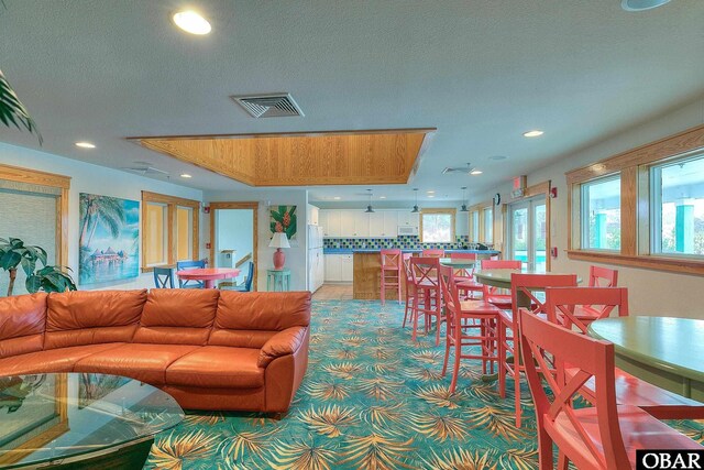 1700 Paget Rd Unit B3, Kill Devil Hills, NC 27948 - living room with recessed lighting and light carpet