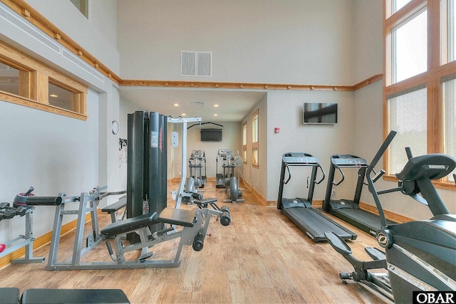 1700 Paget Rd Unit B3, Kill Devil Hills, NC 27948 - workout area with a towering ceiling, wood finished floors, healthy amount of natural light, baseboards, and recessed lighting
