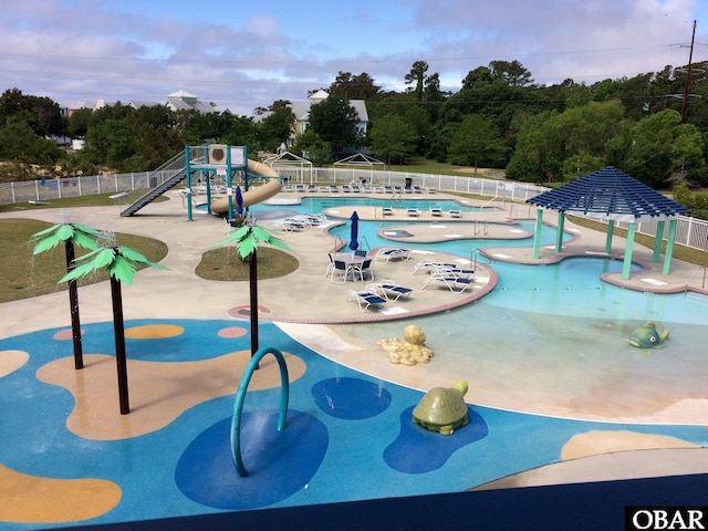 1700 Paget Rd Unit B3, Kill Devil Hills, NC 27948 - view of home's community with a pool, a patio, and view of wooded area