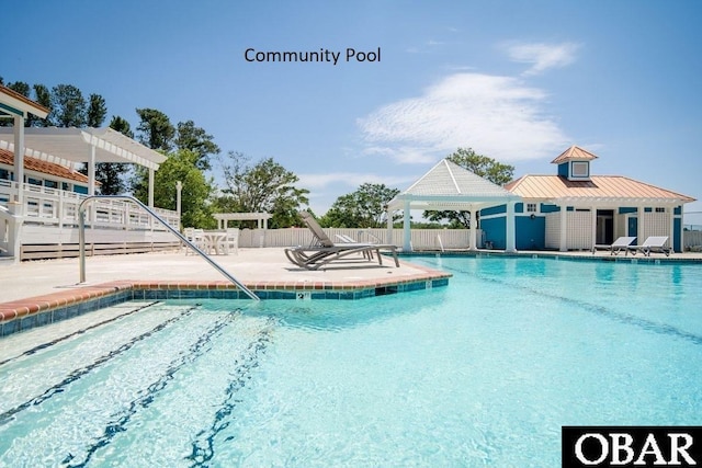 pool featuring a patio area, fence, and a pergola