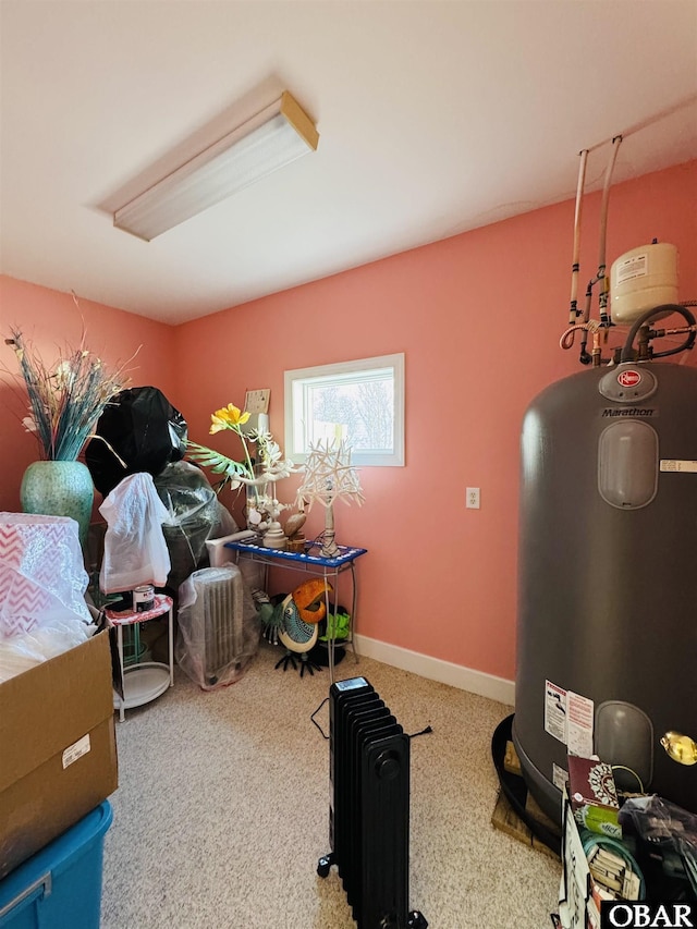 interior space featuring baseboards and electric water heater