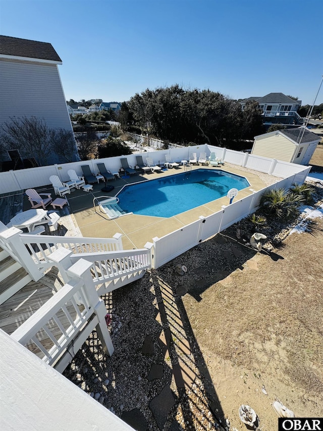 view of swimming pool featuring a fenced backyard and a fenced in pool