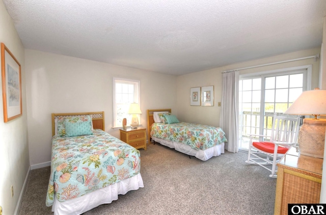 1278 Duck Rd Lot # 51Sh # 4, Duck, NC 27949 - carpeted bedroom with a textured ceiling and access to exterior