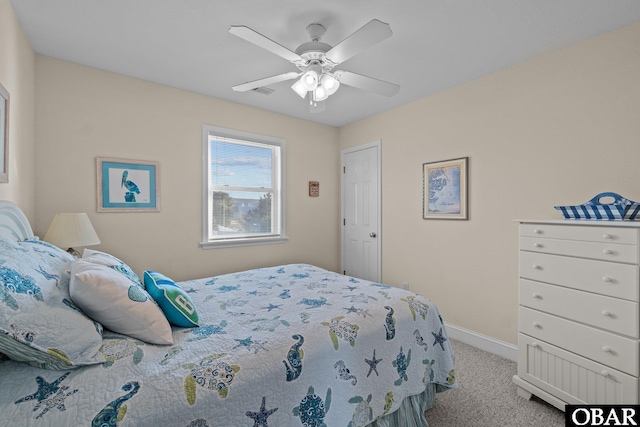 bedroom with light colored carpet, ceiling fan, and baseboards