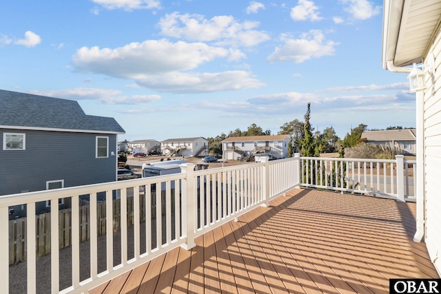 wooden terrace with a residential view