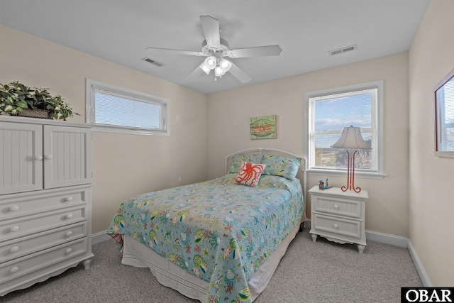 bedroom with baseboards, multiple windows, and visible vents