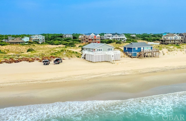 drone / aerial view with a view of the beach and a water view