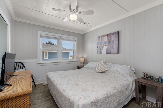 bedroom with ornamental molding, ceiling fan, dark wood-type flooring, and visible vents