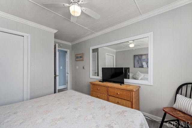 bedroom with a ceiling fan and crown molding