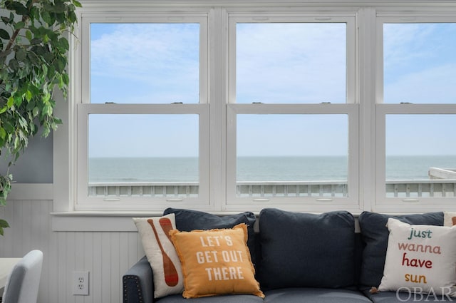 interior space with a water view and plenty of natural light