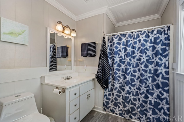 full bathroom featuring toilet, ornamental molding, wood finished floors, and vanity