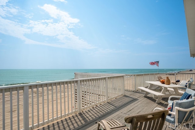 deck with a water view and a view of the beach