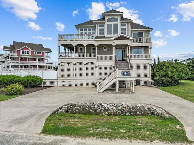 view of front facade with stairway and a porch