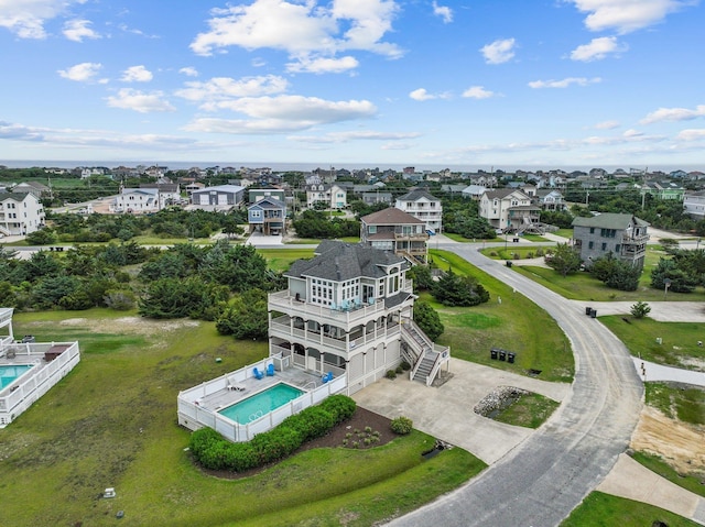 birds eye view of property with a residential view