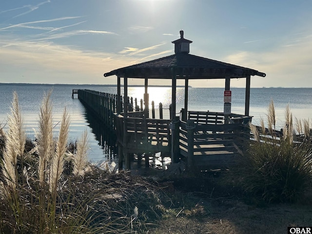 view of dock with a water view and a gazebo