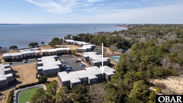 birds eye view of property with a water view