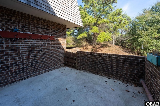 view of patio featuring fence