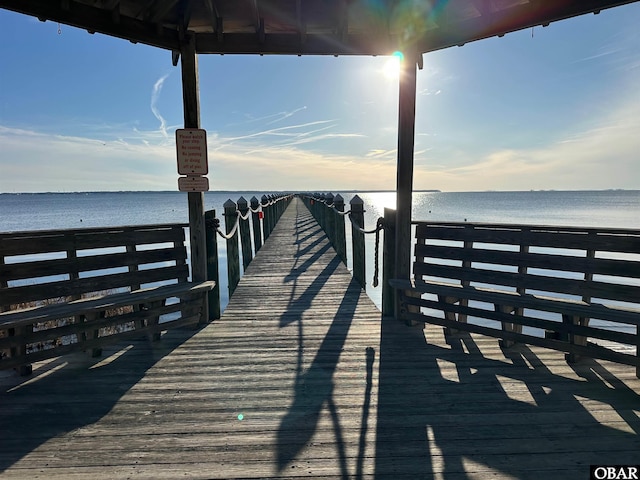 view of dock with a water view and a gazebo