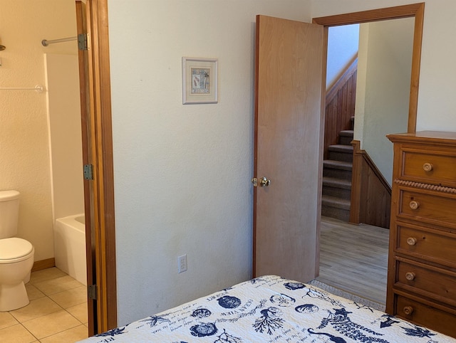 bedroom featuring light tile patterned floors