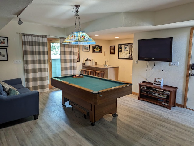 playroom with recessed lighting, pool table, wood finished floors, baseboards, and indoor wet bar