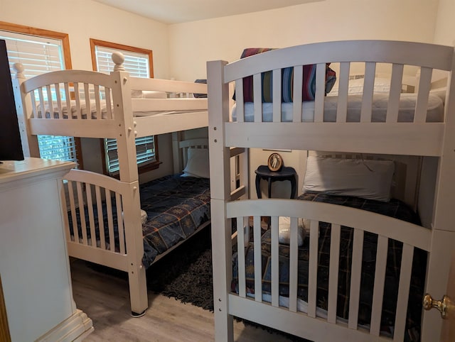 bedroom featuring wood finished floors