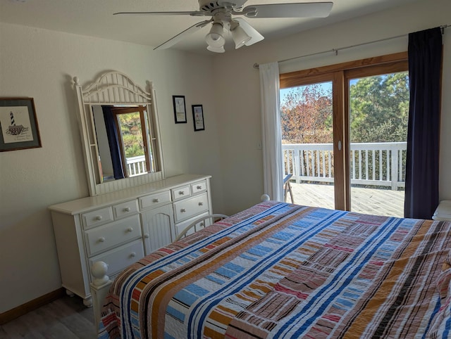 bedroom with access to outside, multiple windows, wood finished floors, and a ceiling fan