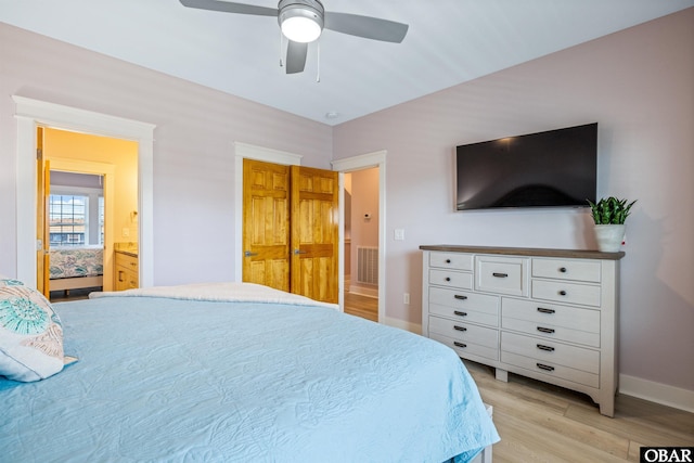 1726 Bobby Lee Trl Lot 5, Kill Devil Hills, NC 27948 - bedroom with light wood-style floors, baseboards, ceiling fan, and connected bathroom