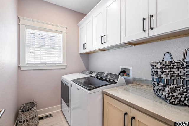1726 Bobby Lee Trl Lot 5, Kill Devil Hills, NC 27948 - washroom with cabinet space, light wood-style flooring, baseboards, and washer and clothes dryer