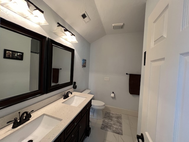 bathroom featuring marble finish floor, visible vents, vaulted ceiling, and a sink