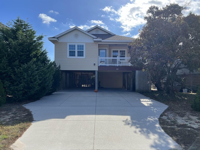 beach home with a carport and concrete driveway