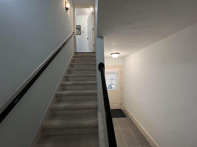 staircase with baseboards