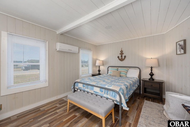 bedroom featuring dark wood-style flooring, a wall mounted AC, beam ceiling, and baseboards