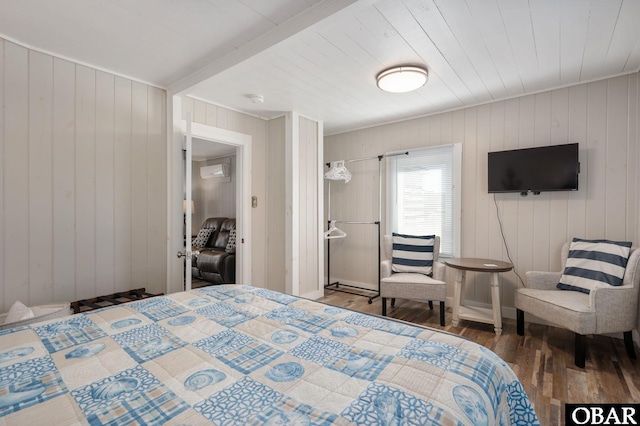 bedroom with dark wood finished floors