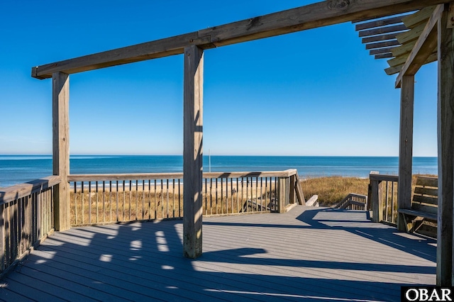 deck featuring a water view and a view of the beach