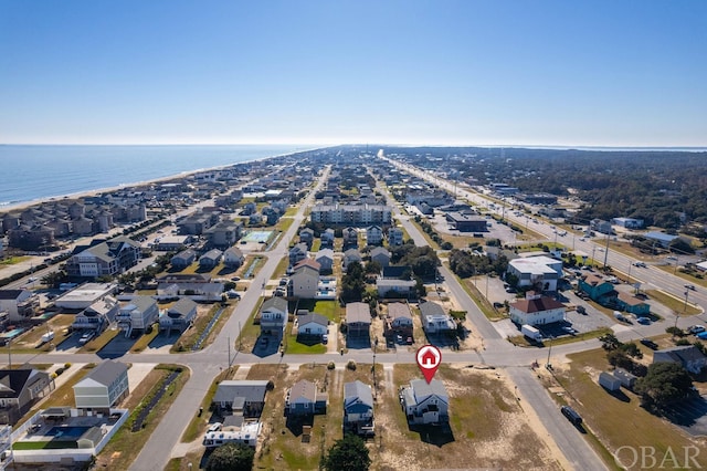 drone / aerial view with a water view and a residential view