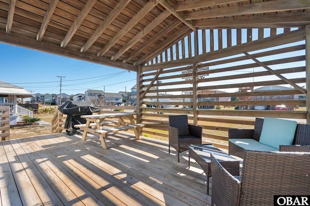 wooden terrace with stairway and a grill