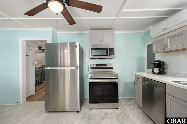 kitchen with light countertops, appliances with stainless steel finishes, and gray cabinets