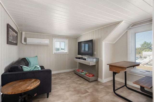 living area featuring a wall unit AC and baseboards