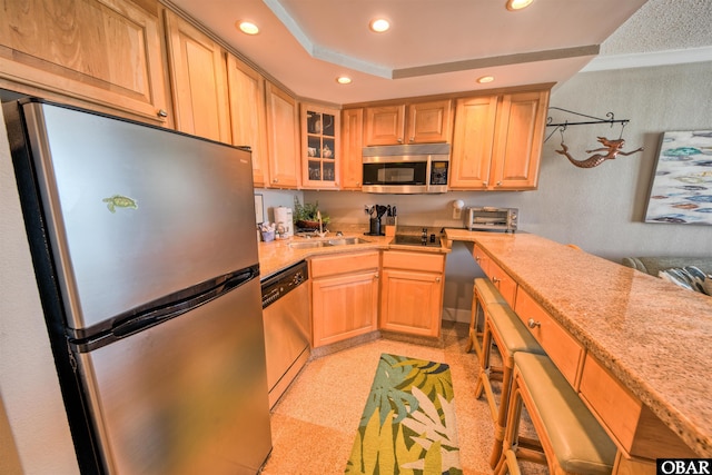 58822 Marina Way Unit 208, Hatteras, NC 27943 - kitchen with stainless steel appliances, recessed lighting, light countertops, glass insert cabinets, and light brown cabinets